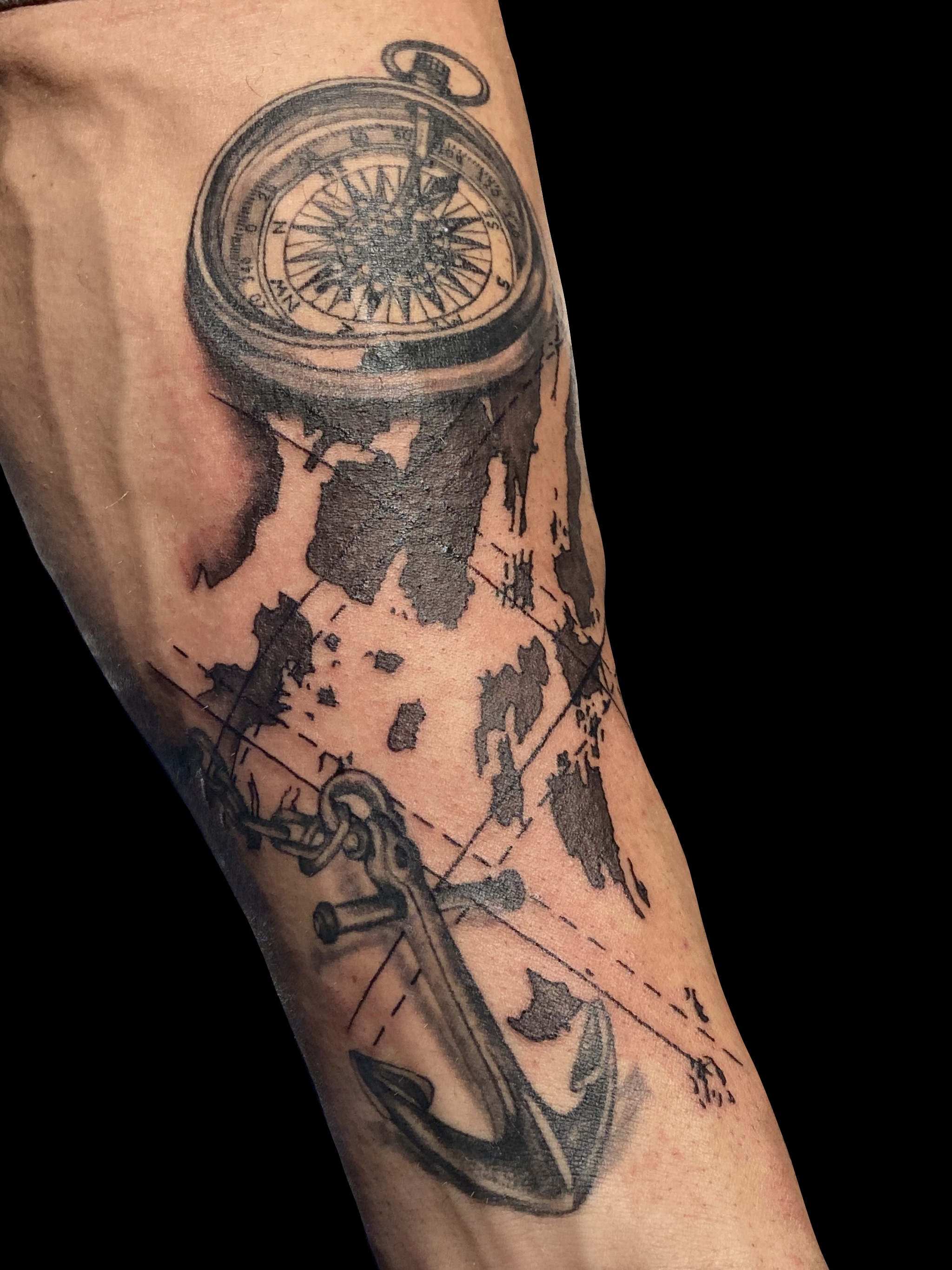 Realism map and compass tattoo gallery cover by Embodiment of Ink